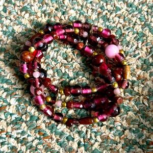 NWOT Beaded bracelet with purples, pinks, and gold